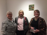 Dr. Nancy English and Linda Lindsey with the artist, in front of "The Mad Queen", which is encaustic mixed media on panel.